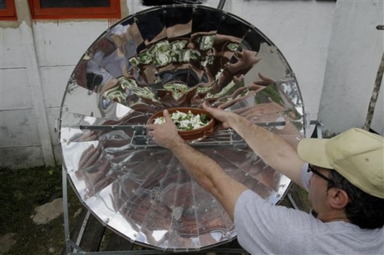 Cuban chef Inti Langaney cooks vegetarian food using solar energy at the eco-restaurant 'el Romero' in Pinar del Rio, Cuba, Tuesday, Feb. 15, 2011. Despite this kind of creativity, Cuba's state-run vegetarian restaurants had to start offering meat due to customer demand.